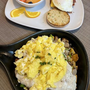 Peaches Brunch House - Bacon, egg, cheese muffin with fresh fruit. Country skillet with potatoes. - Breakfast & Brunch Near Me - Romeo, Michigan Peaches Brunch House - Bacon, egg, cheese muffin with fresh fruit. Country skillet with potatoes. - Breakfast & Brunch Near Me - Romeo, Michigan