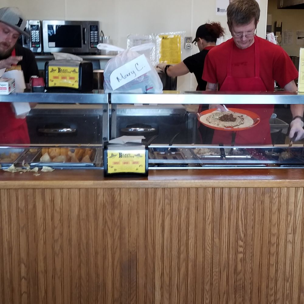 Bravo Burrito - a man and a woman behind the counter - Mexican Near Me - Saint Cloud, Minnesota
