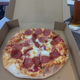 Pepperoni Pizza and an Ommegang Rare Vos Amber Ale. Pepperoni Pizza and an Ommegang Rare Vos Amber Ale.