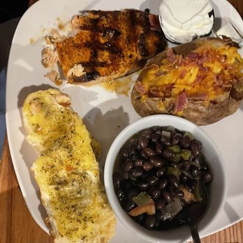 Locos Grill & Pub - Salmon plate with black beans and loaded baked potato - New American Near Me - Athens, Georgia Locos Grill & Pub - Salmon plate with black beans and loaded baked potato - New American Near Me - Athens, Georgia
