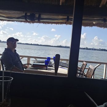 Lorenzillo's - Guy escorted by same manager. Wearing a hat. - Seafood Near Me - Cancún, ROO