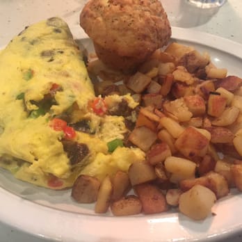 Wild Eggs - Omelette with sausage, peppers and mushrooms. Home fries and an everything muffin - Breakfast & Brunch Near Me - Lexington, Kentucky Wild Eggs - Omelette with sausage, peppers and mushrooms. Home fries and an everything muffin - Breakfast & Brunch Near Me - Lexington, Kentucky