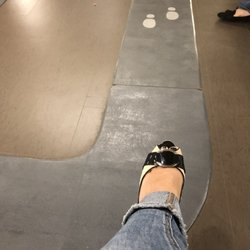 Kaiser Permanente Medical Center-Santa Rosa - Seats have no place for feet given preordained wait line shown in grey mats.