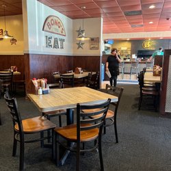 Bono's Pit Bar-B-Q - Sitting in a booth looking out.