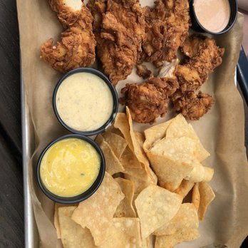 The Yard - Chicken tenders with chips and queso. - Sports Bars Near Me - McKinney, Texas The Yard - Chicken tenders with chips and queso. - Sports Bars Near Me - McKinney, Texas