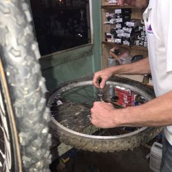 M & M Bike Repair - Adjusting hub bearings.