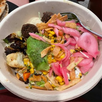 CAVA - Custom bowl w/ rice and mixed greens, roasted vegetables, burnt falafel.... - Mediterranean Near Me - Burke, Virginia