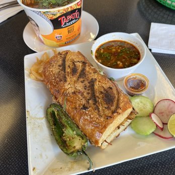 El Sabor De Guadalajara - Torta Birria with a grilled jalapeño on the side. Back: Birria Ramen - Seafood Near Me - Richmond, California