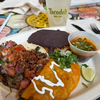 Tacodeli - Brisket El Rey on the left. Birria Taco on the right. - Tacos Near Me - Austin, Texas