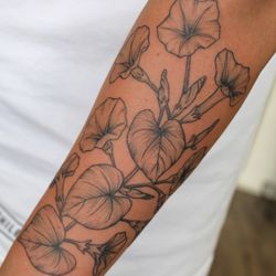 Tiger Lotus Tattoo and Piercing - Super pretty morning glory flowers on the forearm. Tattoo by Felicia.