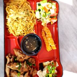 Saigon Bento - Salad, Torpedo Shrimp, Spicy Wontons, Garlic Noodles and Grilled Chicken