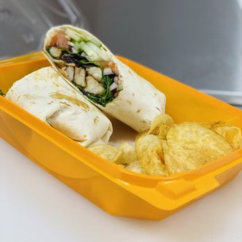 Blenderz - a sandwich and chips in a plastic container - Juice Bars & Smoothies Near Me - Mio, Michigan