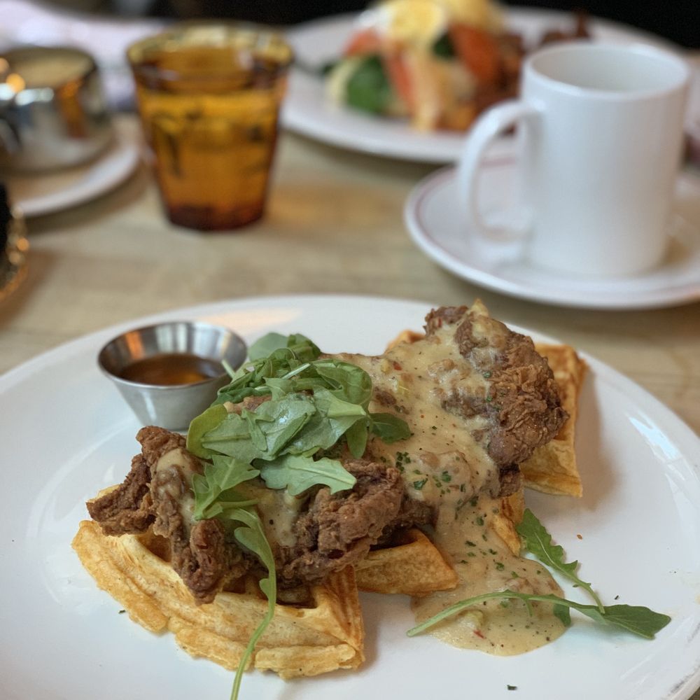 The Bauer Kitchen - Chicken and Waffles with a white sausage gravy and Sirracha honey - American Near Me - Waterloo, Ontario The Bauer Kitchen - Chicken and Waffles with a white sausage gravy and Sirracha honey - American Near Me - Waterloo, Ontario