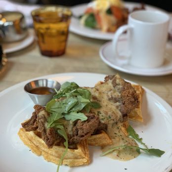 The Bauer Kitchen - Chicken and Waffles with a white sausage gravy and Sirracha honey - American Near Me - Waterloo, Ontario