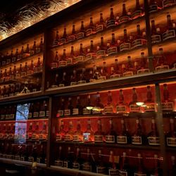 One Eyed Mike's - Bar area, display case showing members only bottles