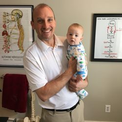 East Cobb Spine & Sport Chiropractic - Dr. Bob and a very happy little baby!
