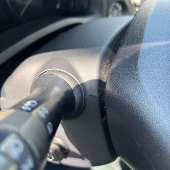 Shine & Dash Detaliing - Behind steering wheel. Can still see dust. - Auto Detailing Near Me