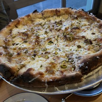 No Saint - pistachi pizza caramelized onion, cantal jeune, pistachio butter, fresh mozzarella, mekkerstee - Pizza Near Me - Portland, Oregon No Saint - pistachi pizza caramelized onion, cantal jeune, pistachio butter, fresh mozzarella, mekkerstee - Pizza Near Me - Portland, Oregon