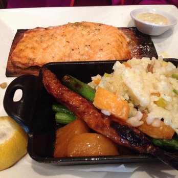 Seasons 52 - Cedar plank salmon and spring vegetables and risotto - New American Near Me - Orlando, Florida Seasons 52 - Cedar plank salmon and spring vegetables and risotto - New American Near Me - Orlando, Florida