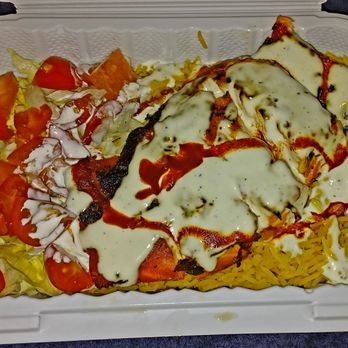 Frozen Lava - Salmon platter with yellow rice  and salad - Delis Near Me - Brooklyn, New York
