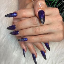 Galaxy shimmer meets midnight sparkle in this elegant stiletto ombre set.