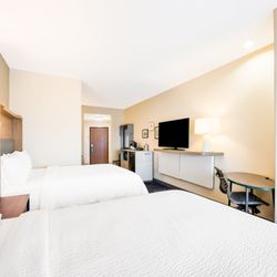 Holiday Inn Brownsville - Spacious guest room with two cozy beds, a work desk, and modern amenities for a comfortable stay in at Holiday Inn Brownsville, an IHG Hotel