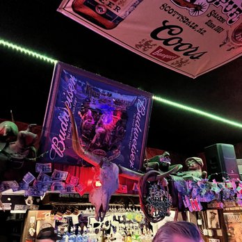 Rusty Spur Saloon - a man sitting at a bar - Music Venues Near Me - Scottsdale, Arizona Rusty Spur Saloon - a man sitting at a bar - Music Venues Near Me - Scottsdale, Arizona