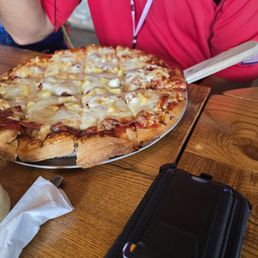 Sausage, pepperoni, and pineapple pizza