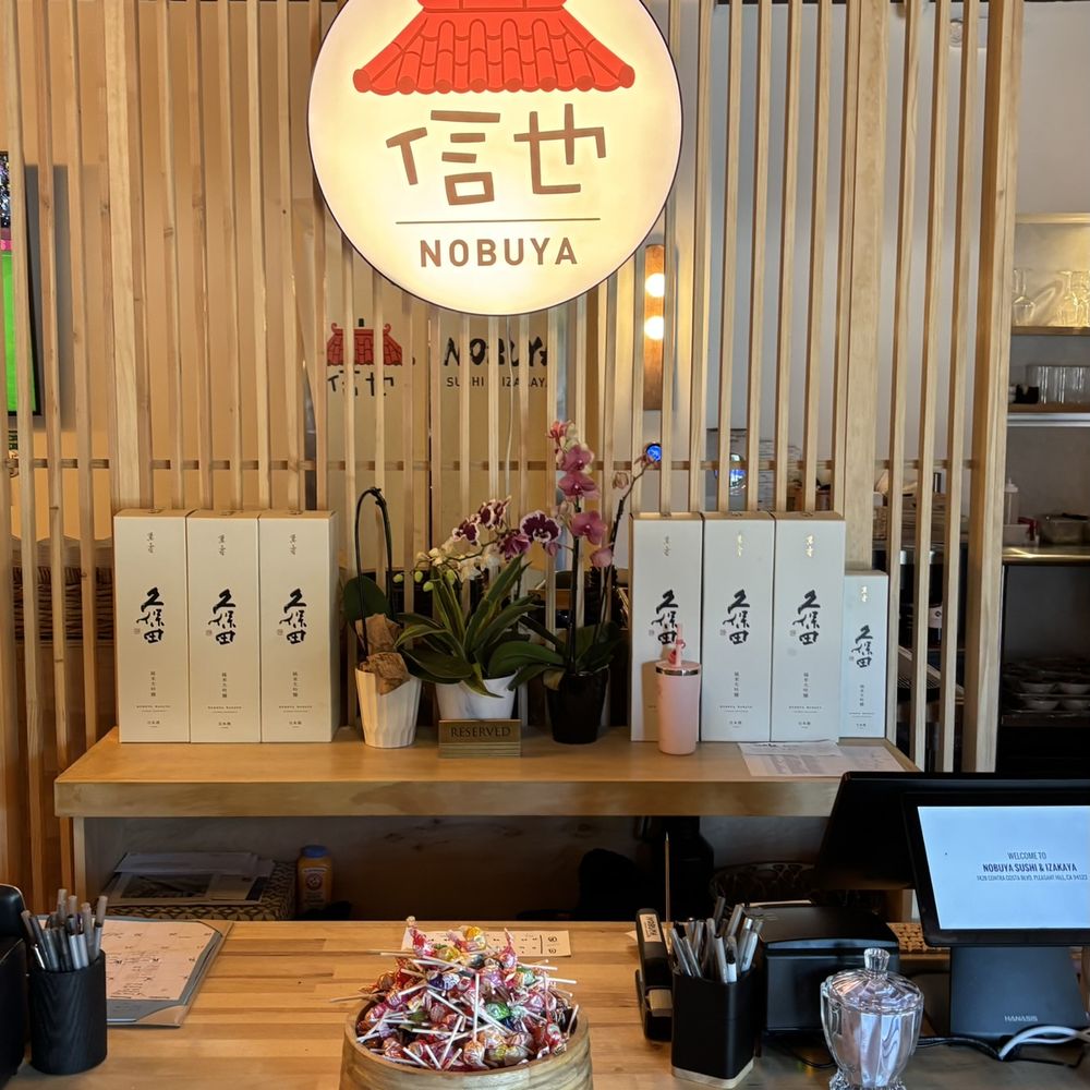 Nobuya - Front counter and logo: Welcome desk under the Nobuya lantern sign - Sushi Bars Near Me - Pleasant Hill, California Nobuya - Front counter and logo: Welcome desk under the Nobuya lantern sign - Sushi Bars Near Me - Pleasant Hill, California
