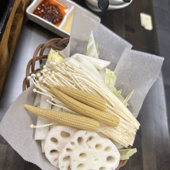 Solo Hot Pot - Lotus root, baby corn, enoki mushrooms, rice cakes, cabbage. - Asian Fusion Near Me - Diamond Bar, California Solo Hot Pot - Lotus root, baby corn, enoki mushrooms, rice cakes, cabbage. - Asian Fusion Near Me - Diamond Bar, California