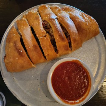 Little Joe's Restaurant - 4 topping Stromboli w/ Spaghetti sauce - New American Near Me - Grand Blanc, Michigan Little Joe's Restaurant - 4 topping Stromboli w/ Spaghetti sauce - New American Near Me - Grand Blanc, Michigan