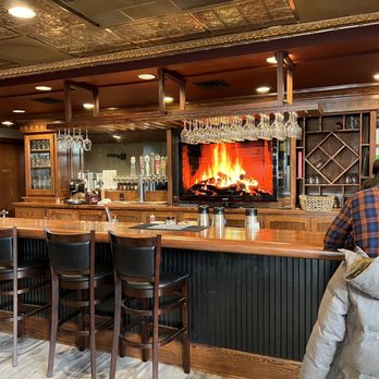 Crimson Door Cafe - a man sitting at a bar - Modern European Near Me - Spokane Valley, Washington Crimson Door Cafe - a man sitting at a bar - Modern European Near Me - Spokane Valley, Washington