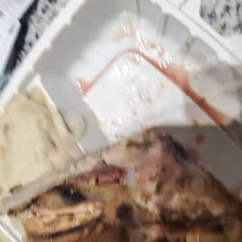Don Pollo - a half eaten meal in a styrofoam container - A seafood dish with shrimp and other seafood items in a white takeout container, accompanied by mashed potatoes. - Latin American Near Me - Chevy Chase, Maryland