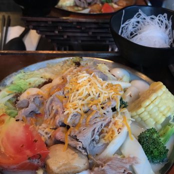 Tasty Pot - Front: Cheesy Milk Hot Pot  Back: Beef Hot Pot - Taiwanese Near Me - Berkeley, California