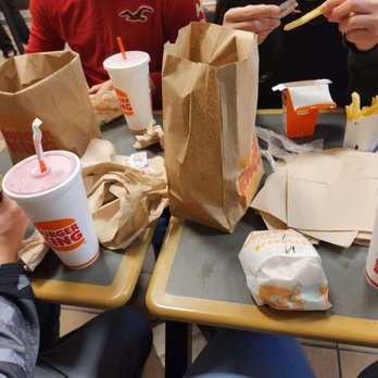 Burger King - a group of people eating at a table - Burgers Near Me - Ruby, New York