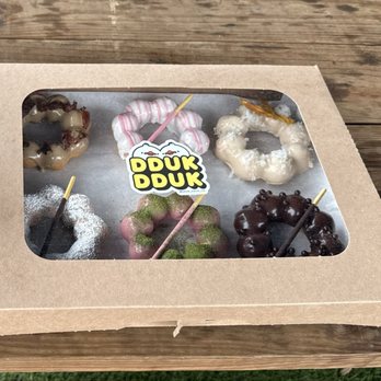 Dduk Dduk - 1/2 dozen - maple bacon, vanilla, coconut, churro, raspberry matcha, chocolate - Donuts Near Me - Austin, Texas