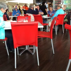 Cafe Coco - Comfy red plastic chairs.