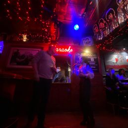 two men standing in a bar two men standing in a bar