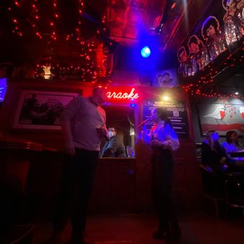 Louie's Pub - two men standing in a bar - Karaoke Near Me - Chicago, Illinois Louie's Pub - two men standing in a bar - Karaoke Near Me - Chicago, Illinois