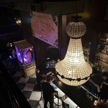 Arcana Spirit Lounge - a bar with a chandelier - Speakeasies Near Me - Vancouver, British Columbia Arcana Spirit Lounge - a bar with a chandelier - Speakeasies Near Me - Vancouver, British Columbia