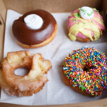YoYo Donuts - Clockwise from top right; fruit punch, chocolate sprinkle cake, glazed old fashion, Chocolate raised with vanilla angel frosting - Donuts Near Me - Minnetonka, Minnesota YoYo Donuts - Clockwise from top right; fruit punch, chocolate sprinkle cake, glazed old fashion, Chocolate raised with vanilla angel frosting - Donuts Near Me - Minnetonka, Minnesota