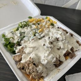 Combo platter with hot sauce on the side. Combo platter with hot sauce on the side.