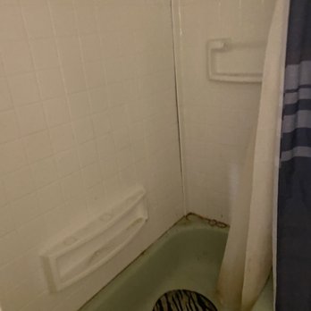 Knaack Properties - Bathroom shower area. You will hear possum behind there. - Property Management Near Me - Kansas City, Missouri Knaack Properties - Bathroom shower area. You will hear possum behind there. - Property Management Near Me - Kansas City, Missouri