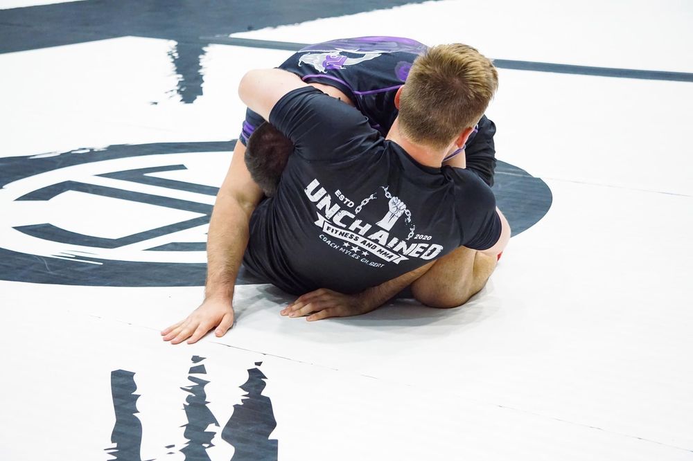 Unchained Fitness & MMA Logo