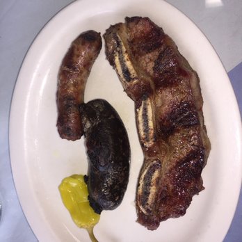 La Esquina Criolla - The No. 1 Short rib, Blood sausage and Chorizo - Argentine Near Me - Elmhurst, New York La Esquina Criolla - The No. 1 Short rib, Blood sausage and Chorizo - Argentine Near Me - Elmhurst, New York