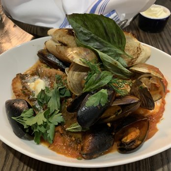 Aviles Restaurant - Seafood Cioppino with salmon, mussels shells, shrimp in cheesy broth - Mediterranean Near Me - St Augustine, Florida