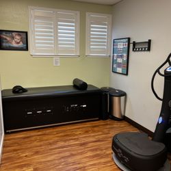 Bautista Chiropractic Care - Massage/traction table and a Power Vibration Plate