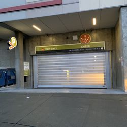 CorePower Yoga - University District - If the garage door is closed, carefully drive on right side, and slowly approach the door. Sensor will automatically open the door.
