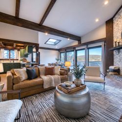 The Haus Windham - Experience the ultimate mountain lifestyle in our breathtaking great room, where rustic charm meets modern luxury.