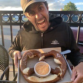 Crooked Pint Ale House - GIGANTIC pretzel and very excited hubby - American Near Me - Fargo, North Dakota Crooked Pint Ale House - GIGANTIC pretzel and very excited hubby - American Near Me - Fargo, North Dakota
